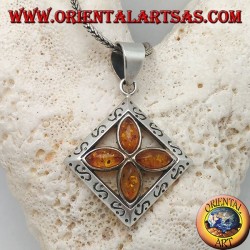 Silver cross pendant of 4 natural shuttle ambers in an engraved square