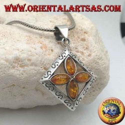 Silver cross pendant of 4 natural shuttle ambers in an engraved square