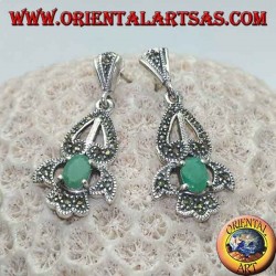 Silver earrings with natural oval emerald set on an elegant openwork frame studded with marcasite