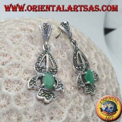 Silver earrings with natural oval emerald set on an elegant openwork frame studded with marcasite