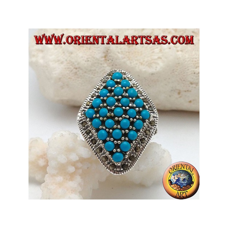 Rhomboid silver ring studded with turquoise balls set surrounded by a row of marcasite stones
