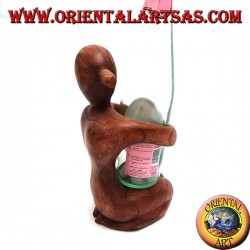 Porte-bouteille sculpture d'une femme agenouillée embrassant en bois de Suar