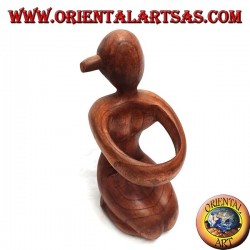 Porte-bouteille sculpture d'une femme agenouillée embrassant en bois de Suar