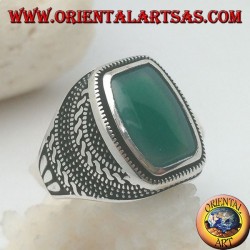 Silver ring with a rectangular green agate rounded in a rosette of balls and weaves