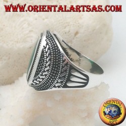 Silver ring with a rectangular green agate rounded in a rosette of balls and weaves