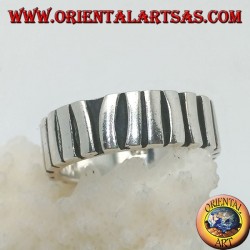 Silver band ring with a row of sticks placed parallel