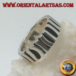 Silver band ring with a row of sticks placed parallel