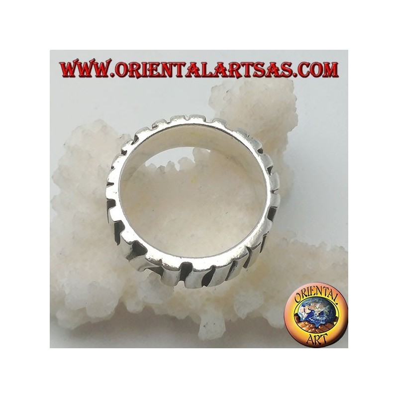 Silver band ring with a row of sticks placed parallel