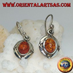 Silver earrings with oval natural amber surrounded by a disc with a ball on the cardinal points