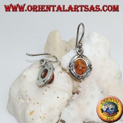 Silver earrings with oval natural amber surrounded by a disc with a ball on the cardinal points