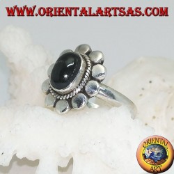 Anillo de flores de plata con cabujón oval estrella negra rodeada de trenzas y disquetes