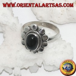 Silver flower ring with oval cabochon black star surrounded by plaiting and diskettes