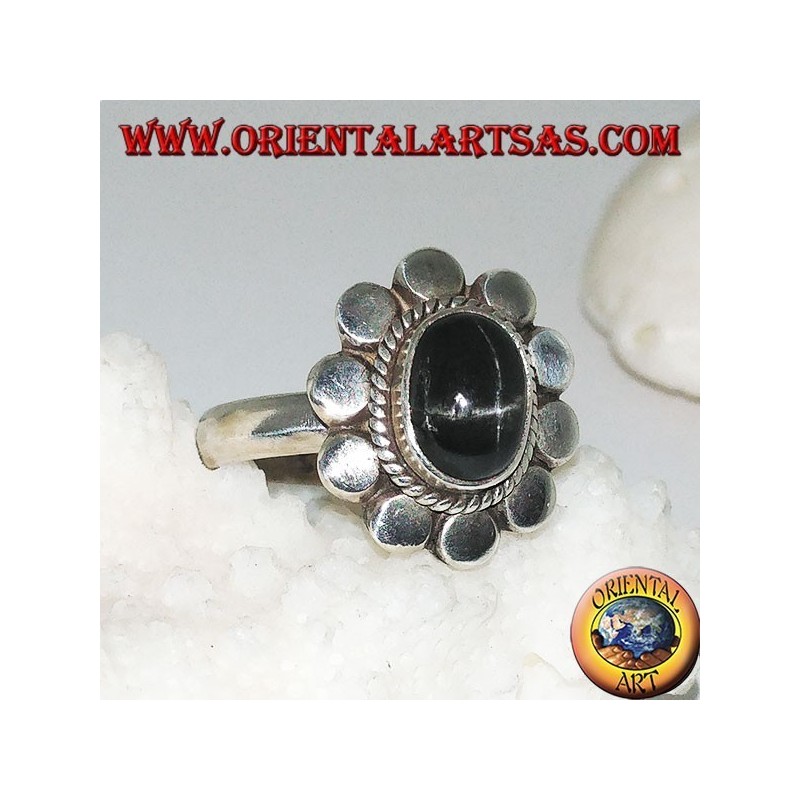 Silver flower ring with oval cabochon black star surrounded by plaiting and diskettes