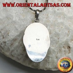 Silver pendant with a face cameo on a fang