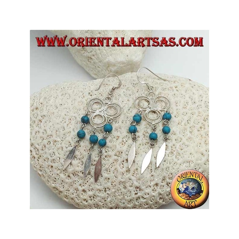 Pendientes de plata de tres círculos con estrella central y hileras colgantes de bolas de turquesa y plata.