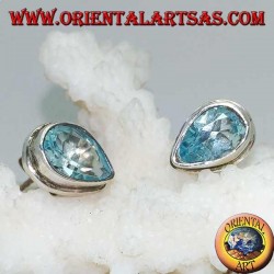 Silver lobe earrings with blue drop topaz on a simple silver setting