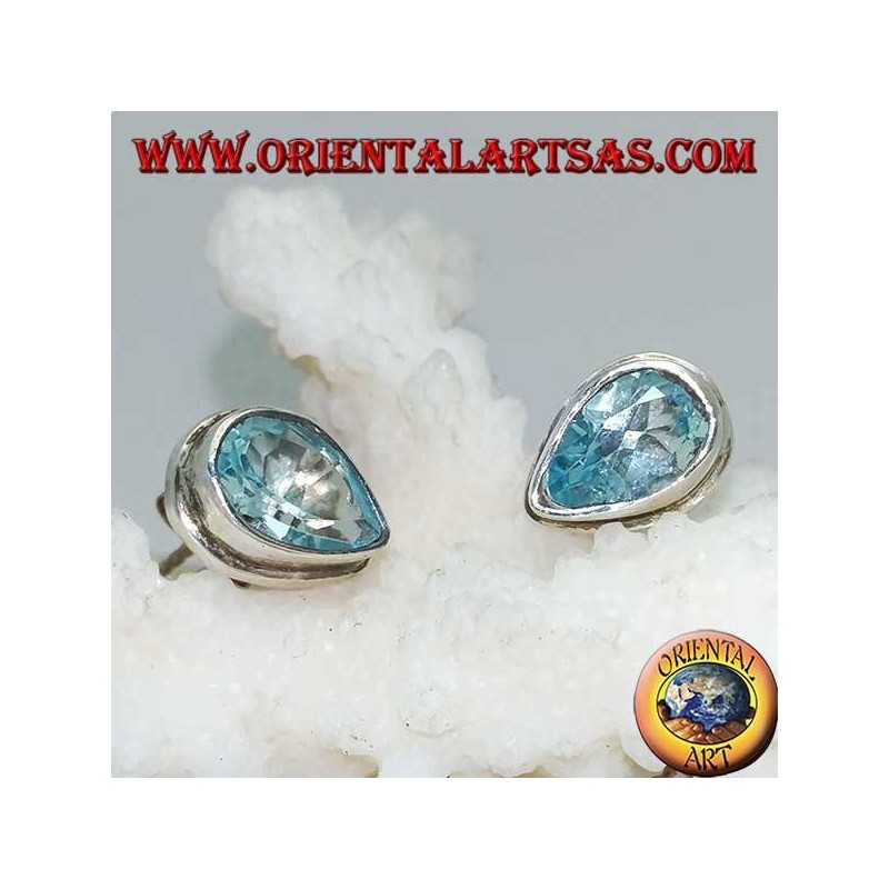 Silver lobe earrings with blue drop topaz on a simple silver setting