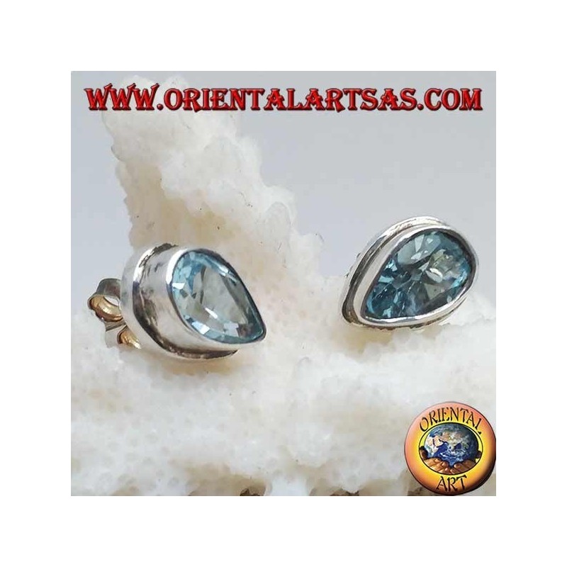 Silver lobe earrings with blue drop topaz on a simple silver setting