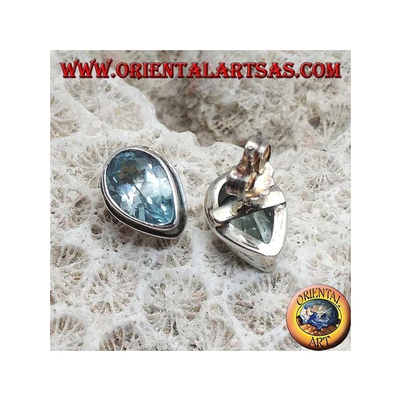 Silver lobe earrings with blue drop topaz on a simple silver setting