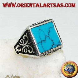 Silver ring with square turquoise, rhombus engravings up and down and high relief decorations on the sides