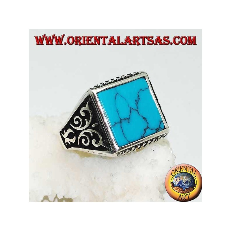 Silver ring with square turquoise, rhombus engravings up and down and high relief decorations on the sides