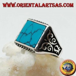 Silver ring with square turquoise, rhombus engravings up and down and high relief decorations on the sides