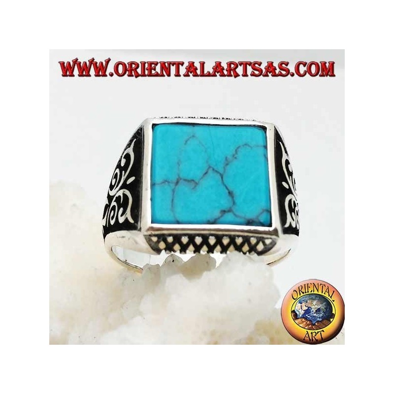 Silver ring with square turquoise, rhombus engravings up and down and high relief decorations on the sides