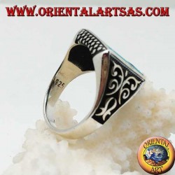 Silver ring with square turquoise, rhombus engravings up and down and high relief decorations on the sides