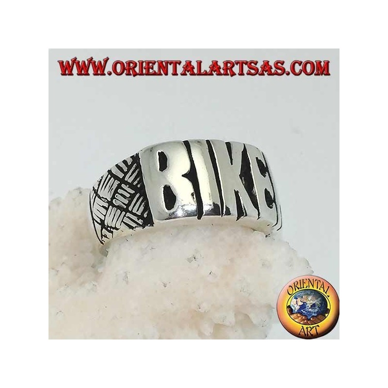 Silver ring with "BIKER" written in block letters and engravings on the sides