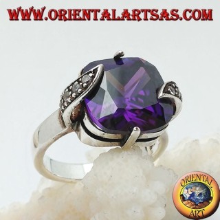 Silver ring with amethyst-colored square zircon set between marcasite leaves