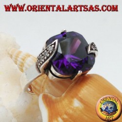 Silver ring with amethyst-colored square zircon set between marcasite leaves