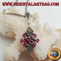Silver pendant with a round ruby in a star of natural oval rubies and two marcasite rhombuses