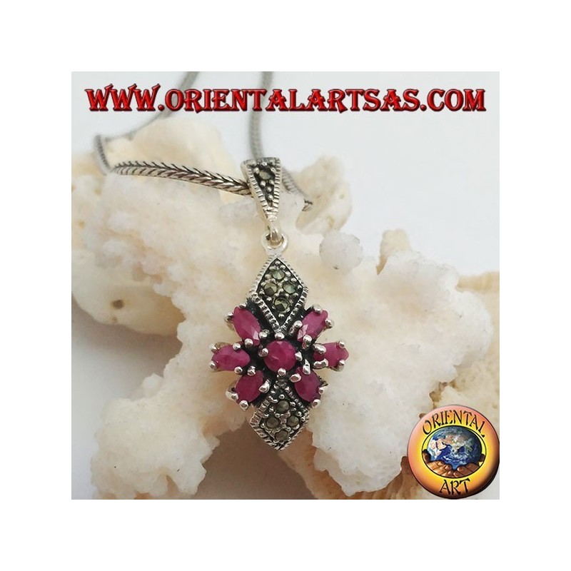 Silver pendant with a round ruby in a star of natural oval rubies and two marcasite rhombuses
