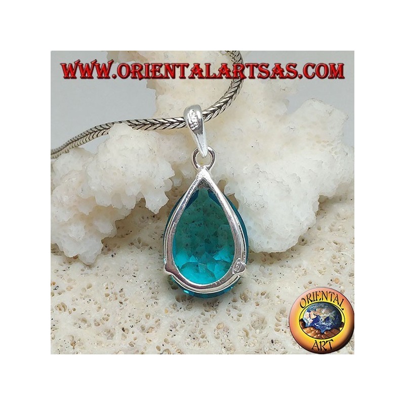 Silver pendant with a faceted blue topaz set