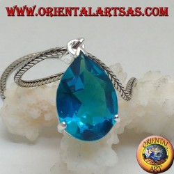 Silver pendant with a faceted blue topaz set
