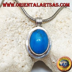 Silver pendant with oval turquoise cabochon on a thick smooth frame and a striped hook