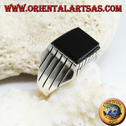 Silver ring with raised rectangular flat onyx and stripes on the sides