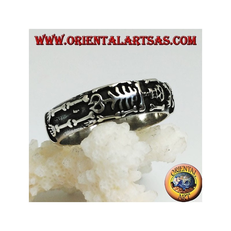 Silver record ring with integral high relief skeleton