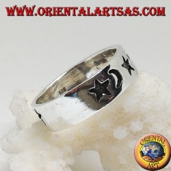 Smooth silver ring with thick engravings of stars and moons