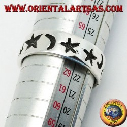 Smooth silver ring with thick engravings of stars and moons