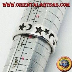 Smooth silver ring with thick engravings of stars and moons