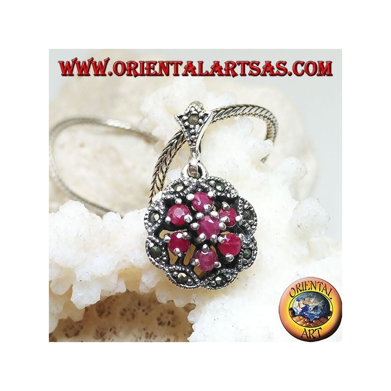 Silver pendant with triple concentric circles of natural round rubies set and shuttle marcasite