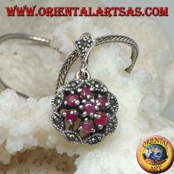 Silver pendant with triple concentric circles of natural round rubies set and shuttle marcasite