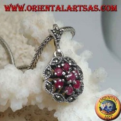 Silver pendant with triple concentric circles of natural round rubies set and shuttle marcasite