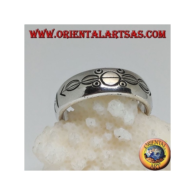 Silver ring with ring engraved circles and ovals impaled by an arrow
