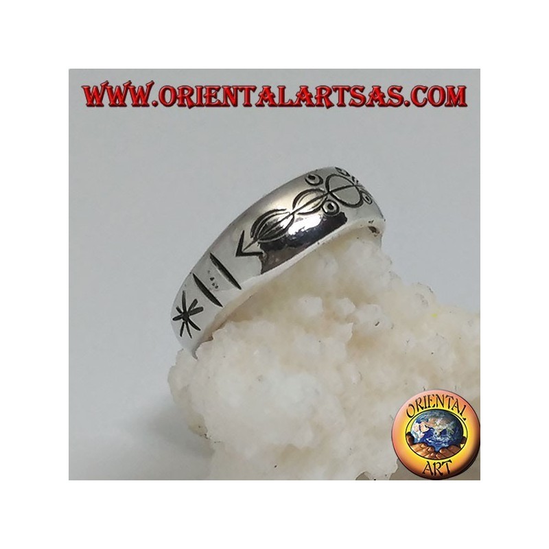 Silver ring with ring engraved circles and ovals impaled by an arrow