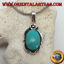 Silver pendant with large oval turquoise on a frame with flower and ribbon
