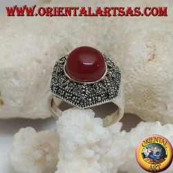 Silver ring with round cabochon carnelian on a decorated perforated hexagon studded with marcasite