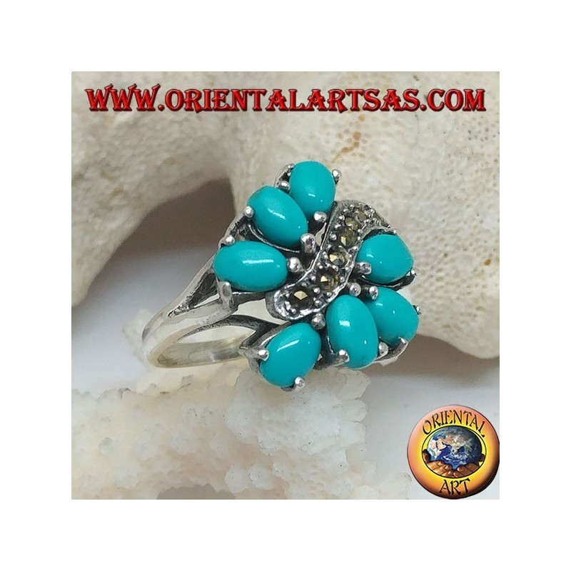 Anello in argento con 7 turchesi ovali incastonati divisi da una linea a onda di marcassite