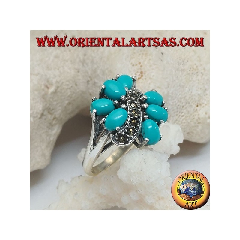 Anello in argento con 7 turchesi ovali incastonati divisi da una linea a onda di marcassite